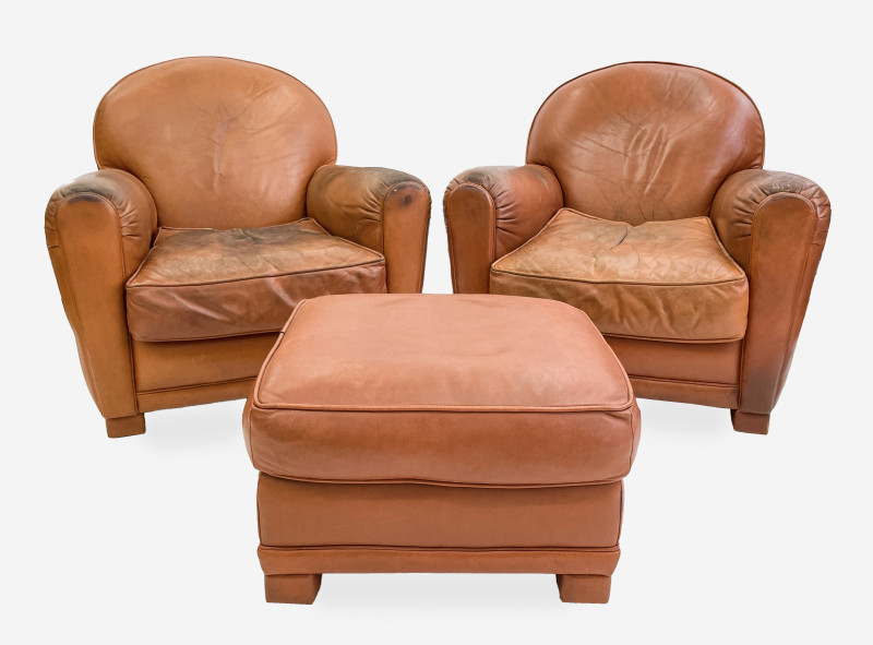 Leather club chairs and ottoman in the style of Ralph Lauren