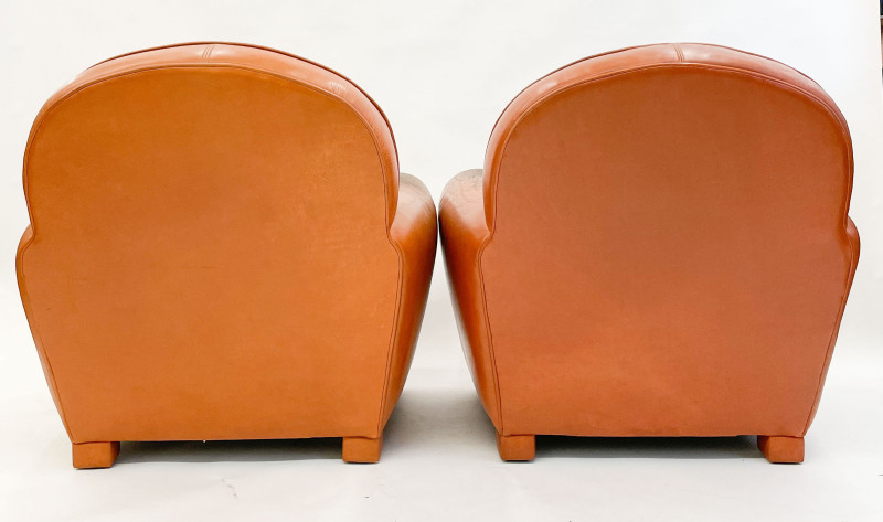 Leather club chairs and ottoman in the style of Ralph Lauren