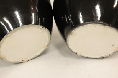 Near Pair of Black Ceramic Planters