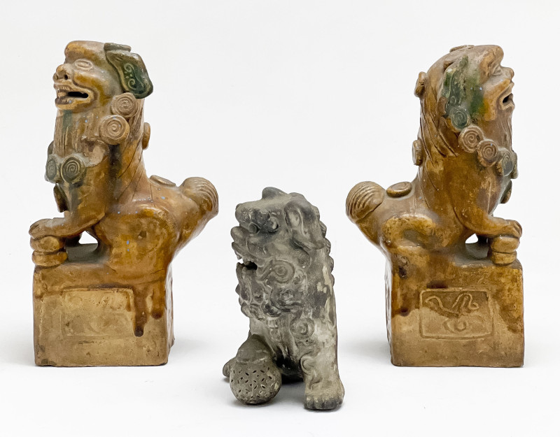Pair of Chinese Glazed Ceramic Buddhist Lions and a Small Lion
