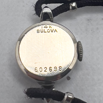 Gold and Diamond Bulova Watch and Gold, Onyx and Diamond Ring