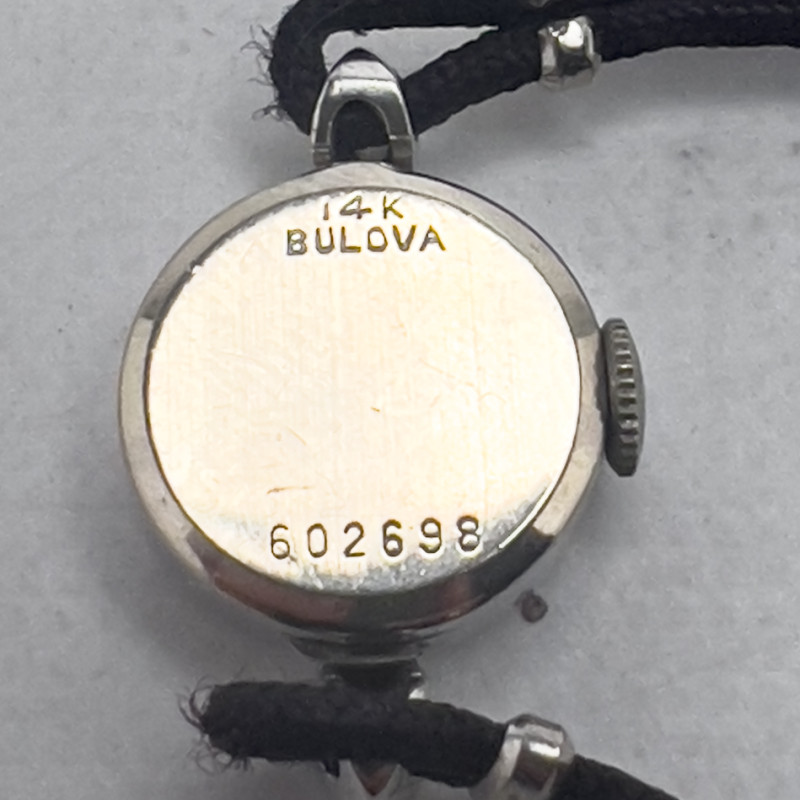 Gold and Diamond Bulova Watch and Gold, Onyx and Diamond Ring