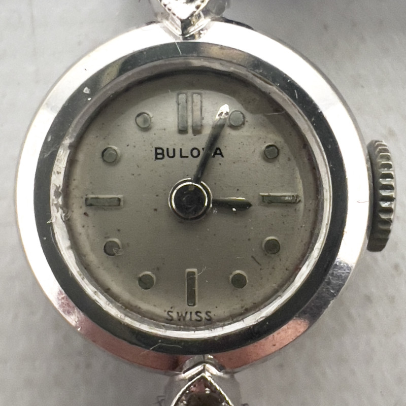 Gold and Diamond Bulova Watch and Gold, Onyx and Diamond Ring