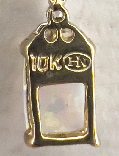 Gold Opal Earrings, Opal and Diamond Ring, and Cameo Pendant