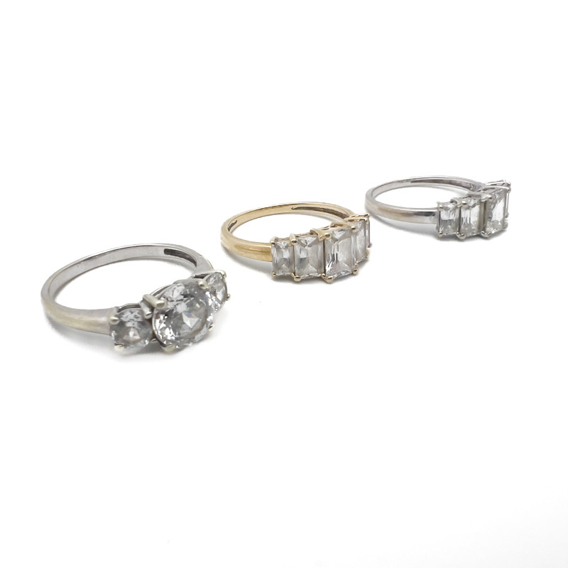 Three Gold Rings With Clear Stones