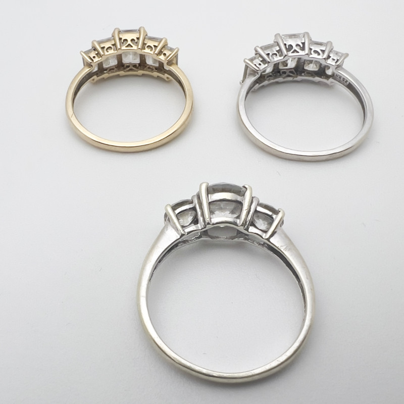 Three Gold Rings With Clear Stones