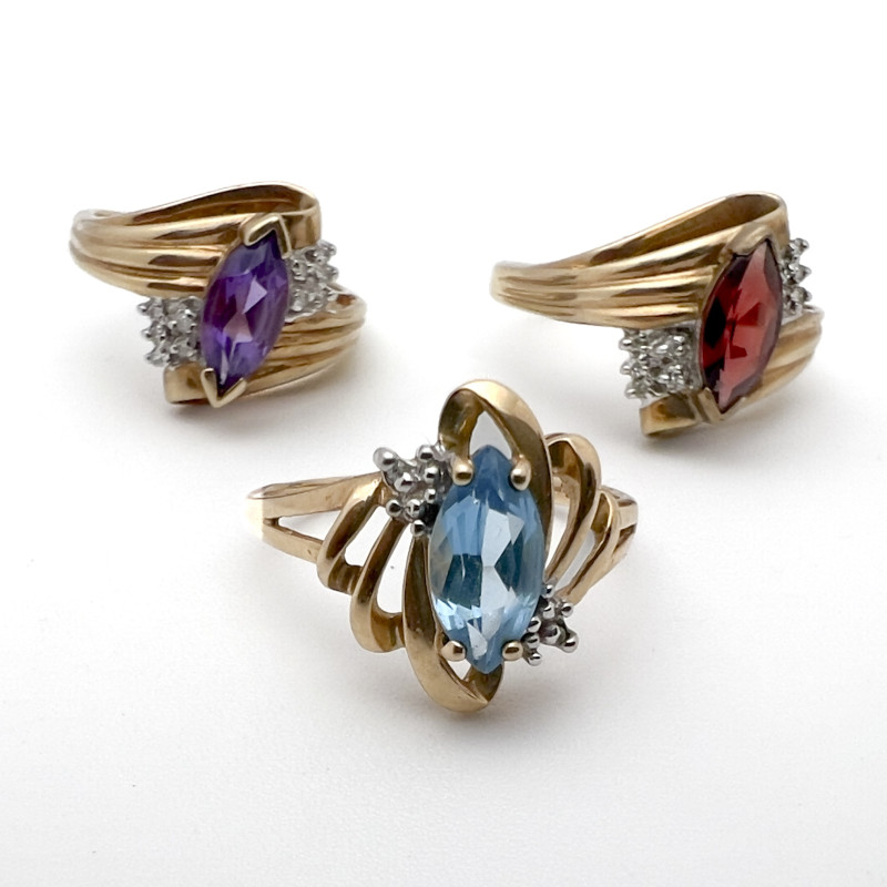 Three Yellow Gold Rings with Gems Topaz Garnet Amethyst
