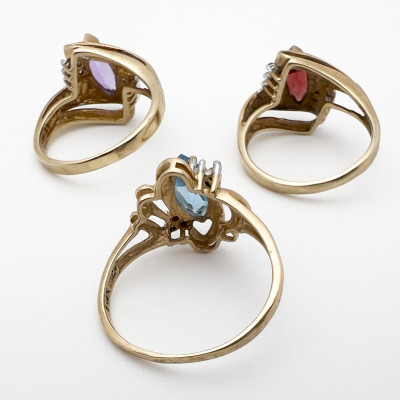 Three Yellow Gold Rings with Gems Topaz Garnet Amethyst