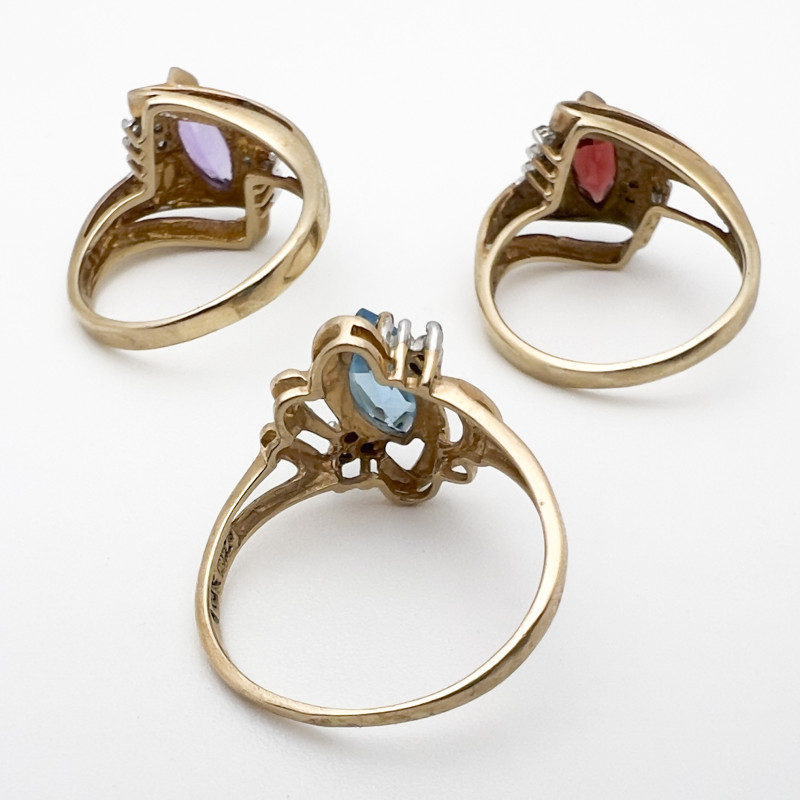Three Yellow Gold Rings with Gems Topaz Garnet Amethyst