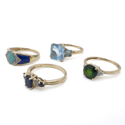 Four Gold Rings With Colorful Gems