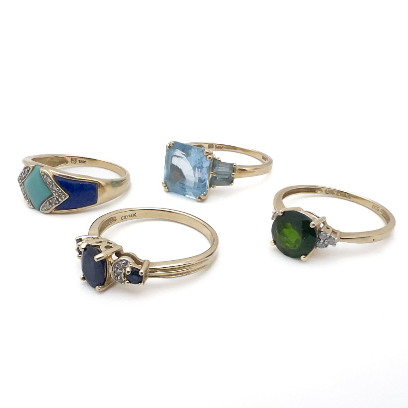 Four Gold Rings With Colorful Gems