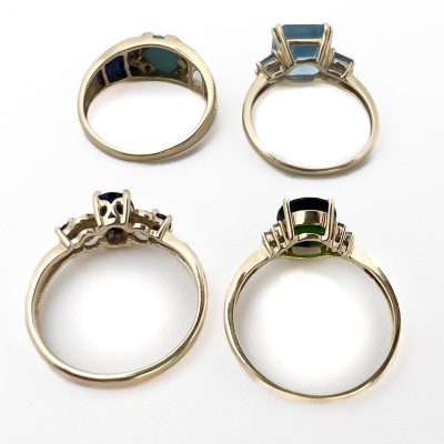 Four Gold Rings With Colorful Gems