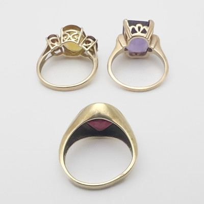 Three Gold Rings With Colorful Gems