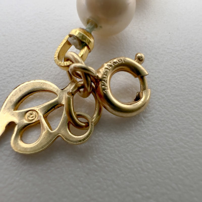 Gold Bracelet and Faux Pearl Bracelet