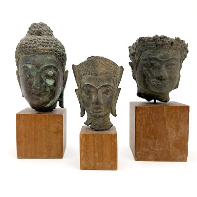 Image for Lot Three Small Buddha Head Fragments Mounted On Stands