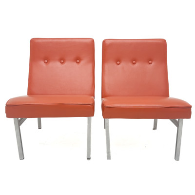 A Pair of Mid-Century Modern Orange Vinyl Slipper Chairs