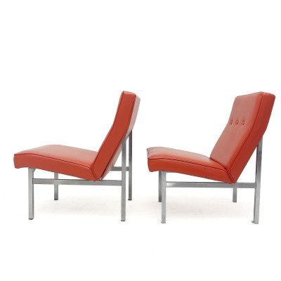 A Pair of Mid-Century Modern Orange Vinyl Slipper Chairs