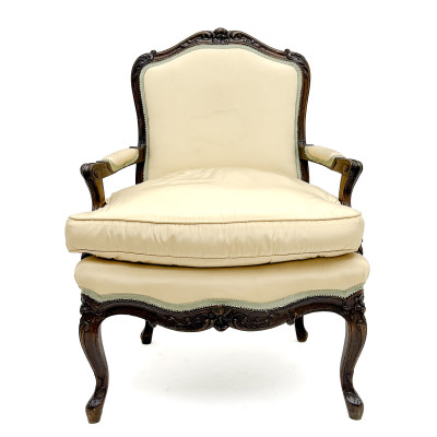 A Louis XV Style Carved Wood Upholstered Bergère