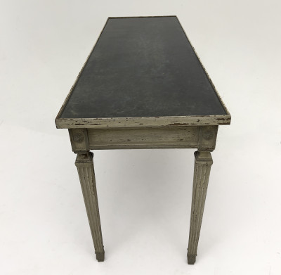 A Neoclassical Style Patinated Wood and Fumé Glass Console Table