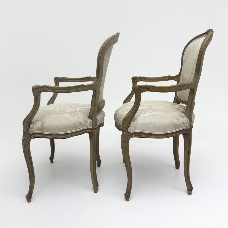 A Pair of Louis XV Style Carved Beechwood Fauteuils