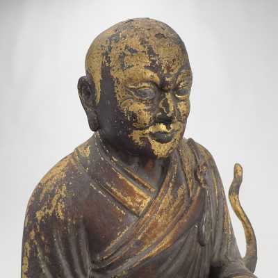 Chinese Polychrome and Parcel-Gilded Wood Figure of a Buddhist Arhat Riding a Lion