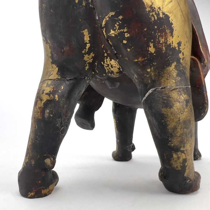 Chinese Polychrome and Parcel-Gilded Wood Figure of a Buddhist Arhat Riding a Lion
