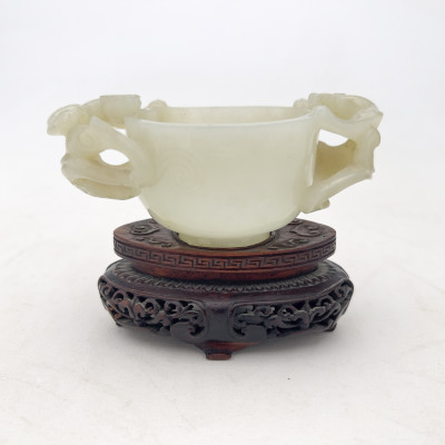 Image for Lot Chinese Carved Celadon Jade Twin-Handled Libation Cup on Fitted Wood Stand