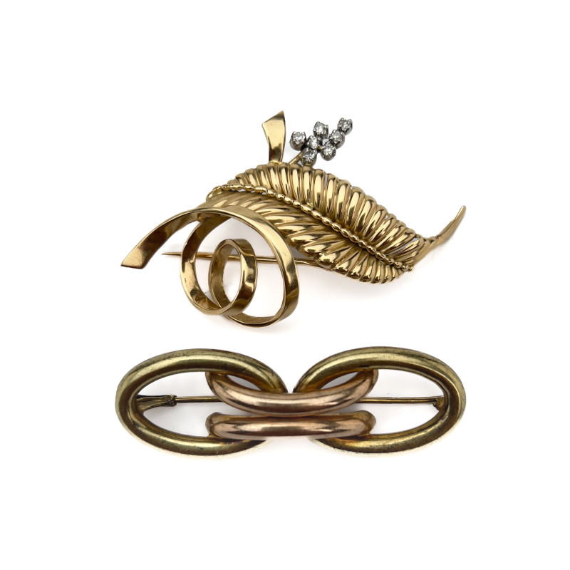 A two-piece 14k gold and platinum brooch lot containing diamonds