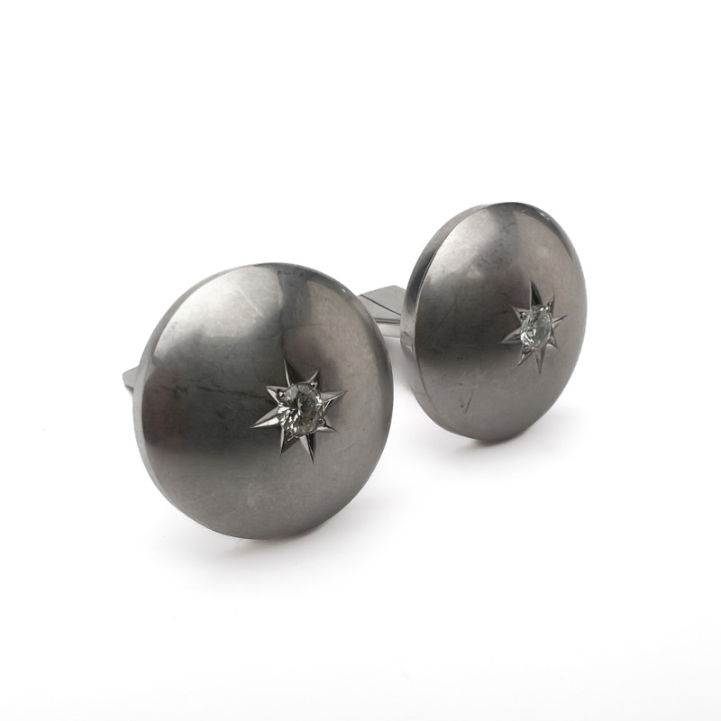 A pair of 14k white gold and diamond cufflinks