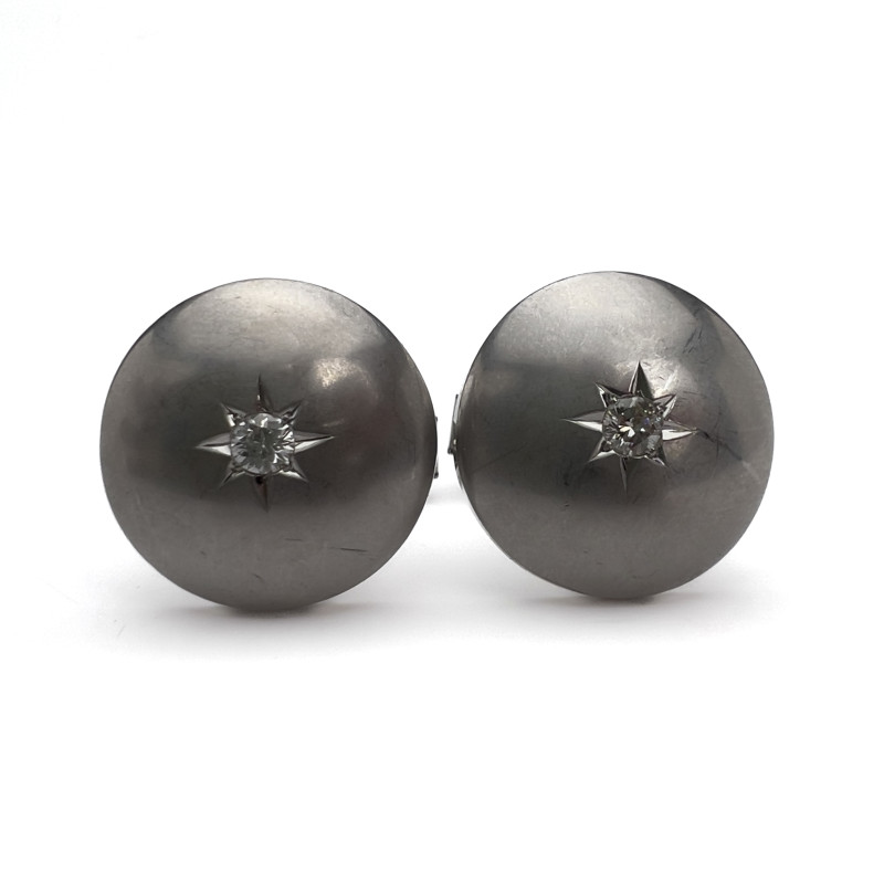 A pair of 14k white gold and diamond cufflinks
