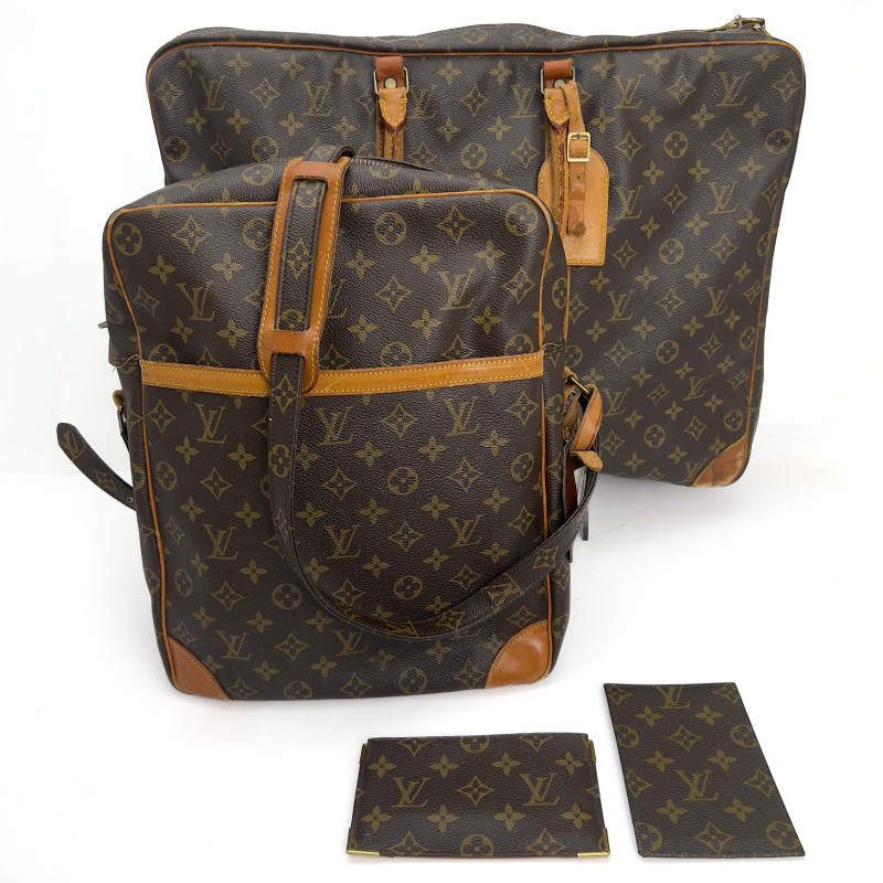 Louis Vuitton - A four-piece leather travel lot