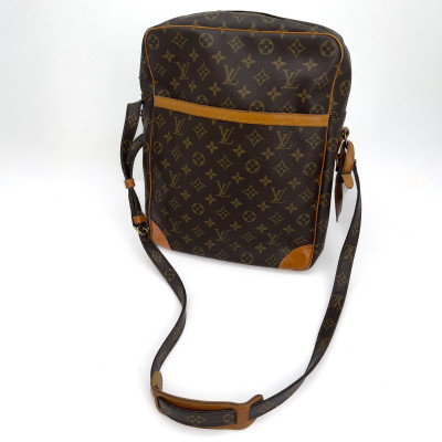 Louis Vuitton - A four-piece leather travel lot