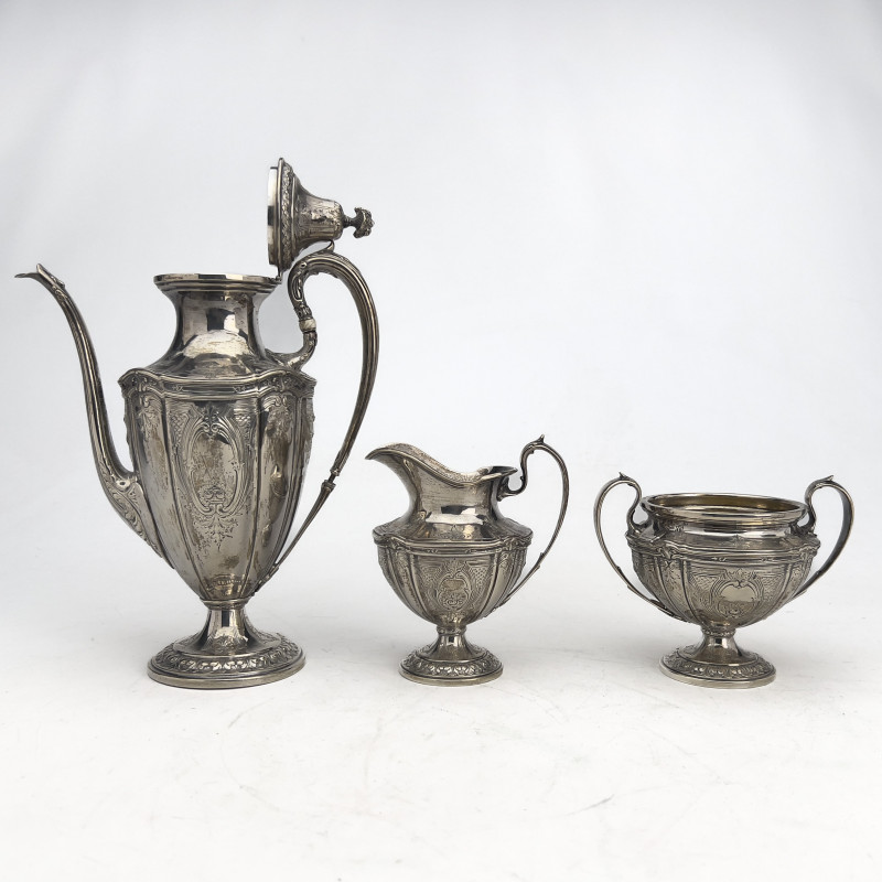 Theodore B. Starr - Four-Piece Coffee Service in Sterling Silver with Accompanying Silver-Plated Tray