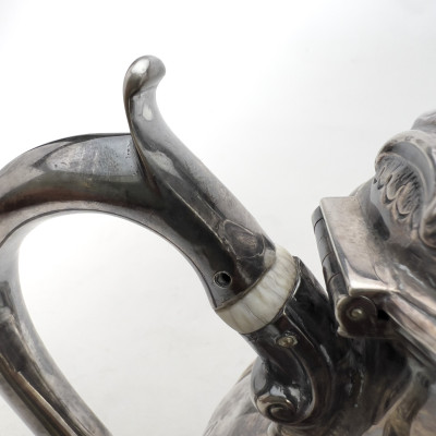 A Victorian British Sterling Silver Repoussé Three-Piece Tea Service