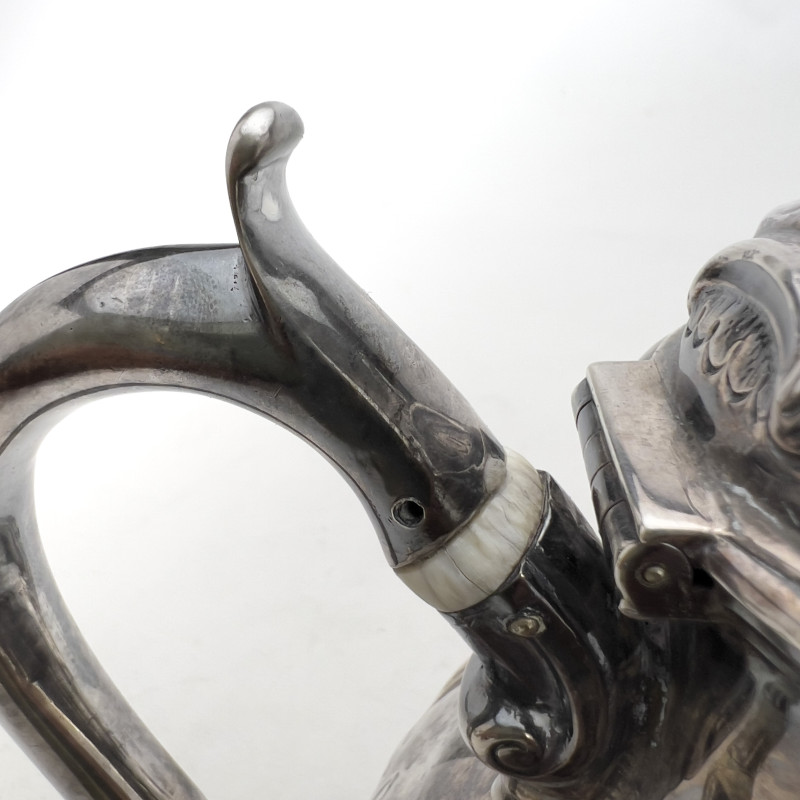 A Victorian British Sterling Silver Repoussé Three-Piece Tea Service