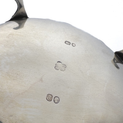 A Victorian British Sterling Silver Repoussé Three-Piece Tea Service