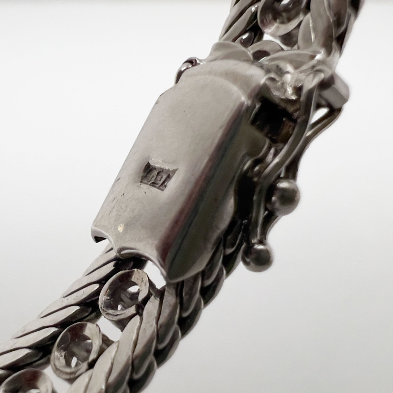 An 18-Karat White Gold and Diamond Tennis Bracelet