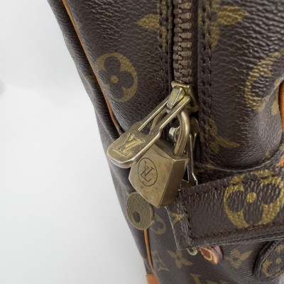 Louis Vuitton - A four-piece leather travel lot