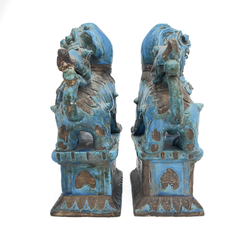 A Pair of Chinese Glazed Turquoise Ceramic Guardian Lions