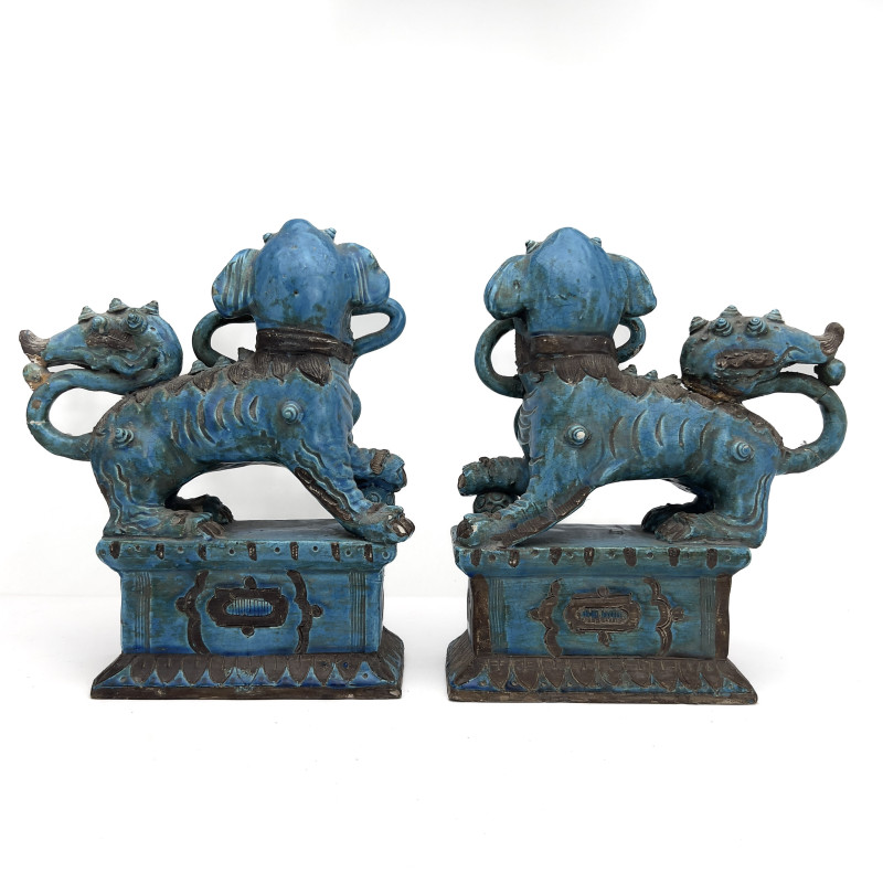 A Pair of Chinese Glazed Turquoise Ceramic Guardian Lions